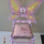 A Pink and Purple Chair With a Butterfly One